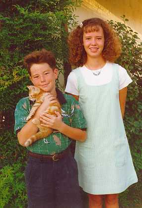 William and Jennifer holding Tommy as a kitten